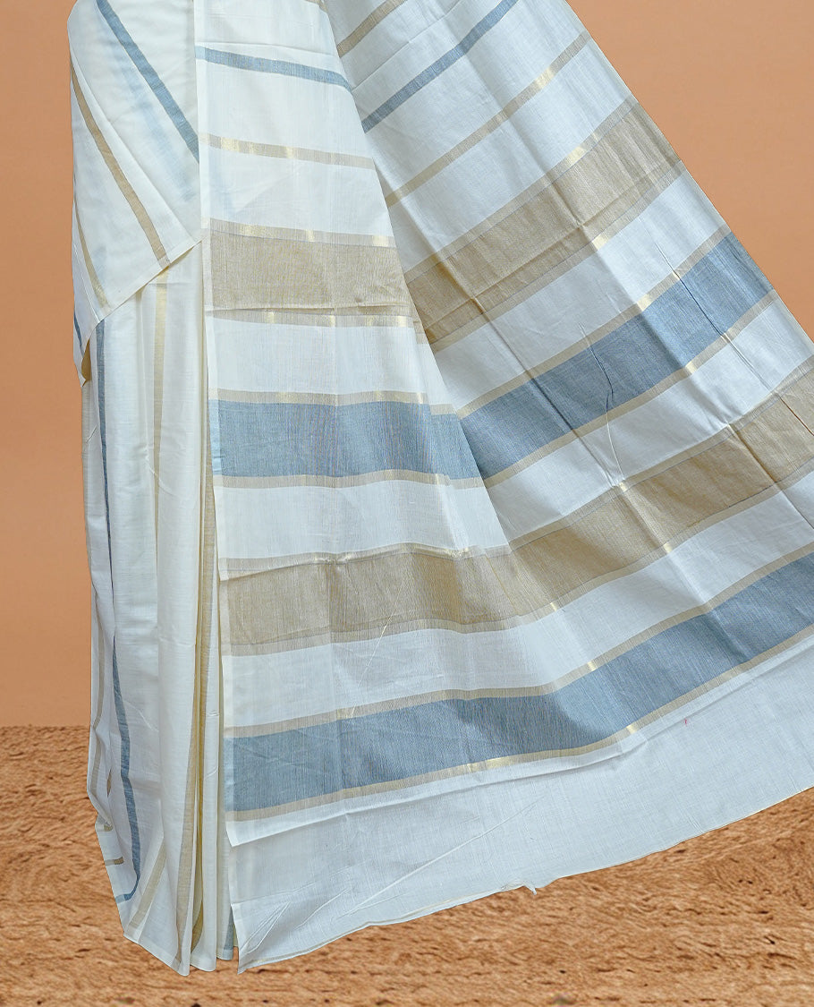 Cream Colour Cotton Kerala Saree Featuring Blue &  Gold Zari Strips On The Body & Pallu, Paired With A Matching Blouse Piece.