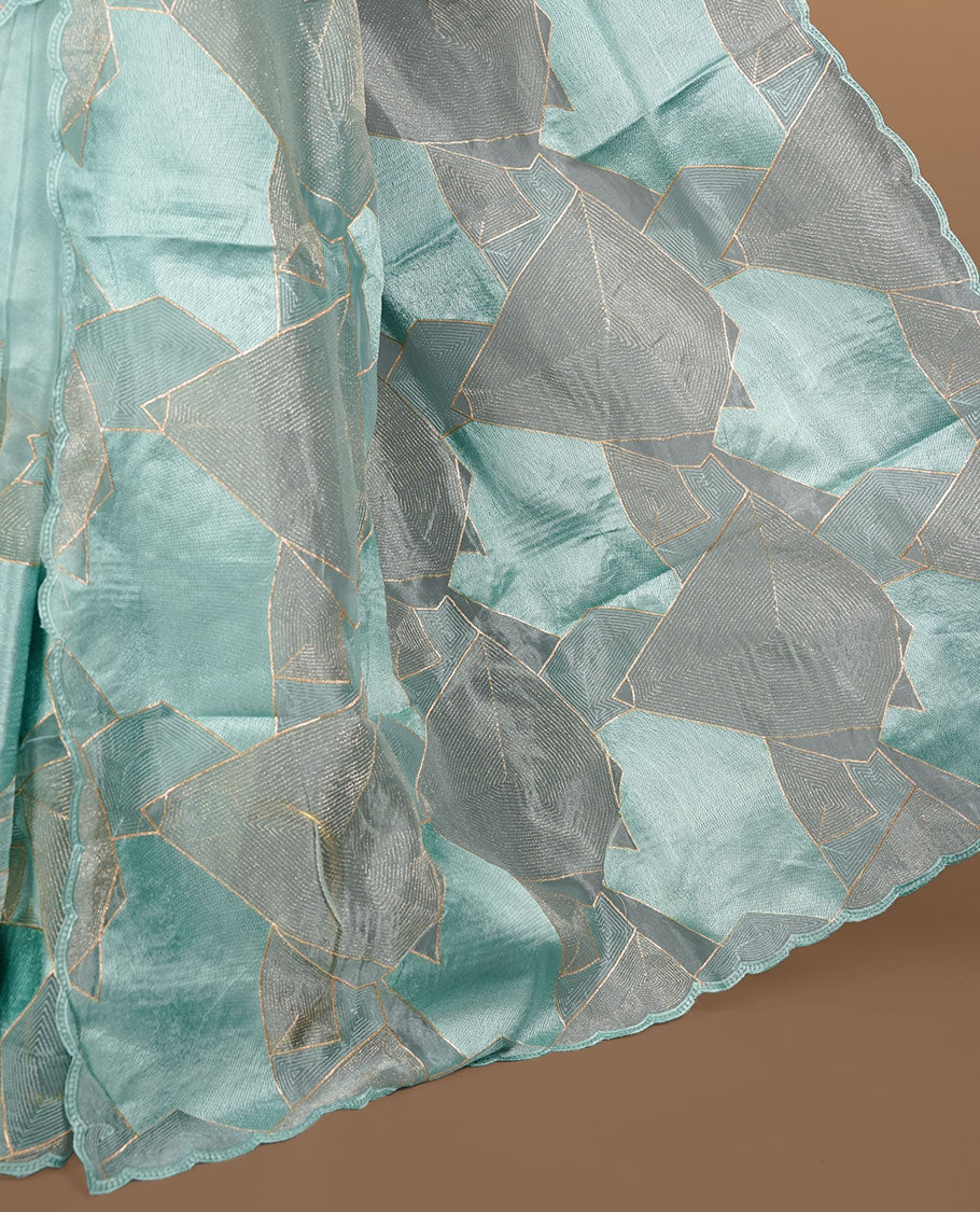 Mint blue colour Organza designer saree featuring a thread geometric pattern across the body, enhanced with a piping border and cut beats work on matching blouse piece.