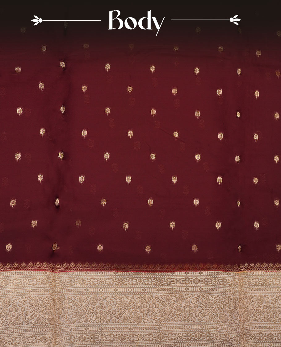 Chocolate brown colour banaras satin crepe saree featuring gold zari motifs on body, with contrast cream colour border with gold zari pattern and paired with matching blouse.