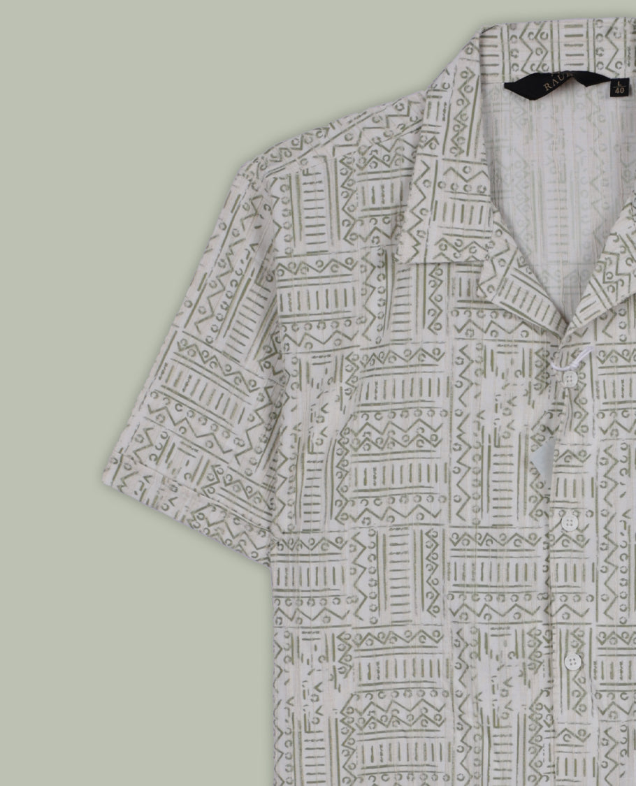 Off white colour shirt adorned with green geometric prints, Designed with a classic collar and full sleeves, it blends effortless style with everyday comfort.