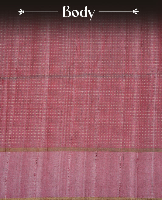 Mauve colour semi tussar silk saree featuring elegant gold zari dotted stripes across the body, enhanced with a rich zari woven border. Comes with a matching blouse piece.