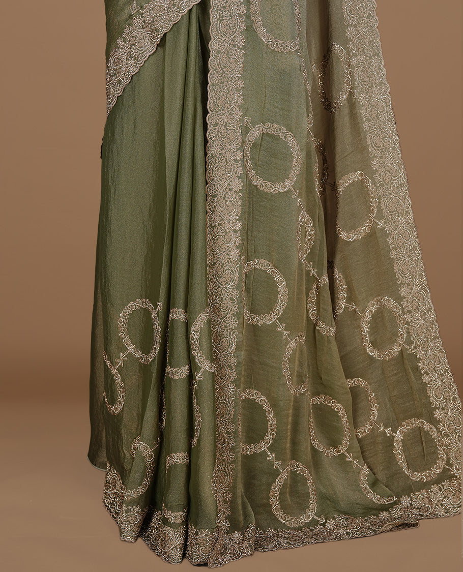 Olive colour organza saree featuring thread & gold stone pattern on body, highlighting scalp border, paired with Matching blouse piece.