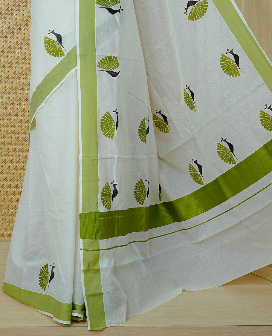 Cream colour Cotton Kerala saree Featuring Classy Plain body for Effortless Elegance, enhancing Green with Peacock Printed border, paired with matching blouse piece.