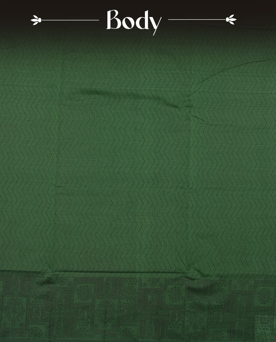 Dark green colour poly cotton saree with black zigzag line pattern on the body, paired with a matching pallu featuring black chevron lines and panelled floral‑paisley design, and a coordinated all‑over floral paisley patch‑style printed blouse piece.