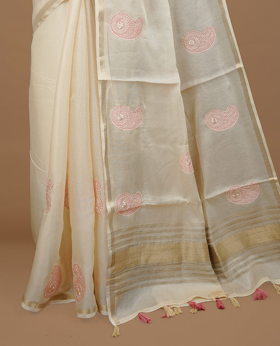 Cream colour Tussar saree featuring pink colour Mango pattern with chikankari embroidery work, highlighting gold zari simple border, paired with matching unstitched blouse.