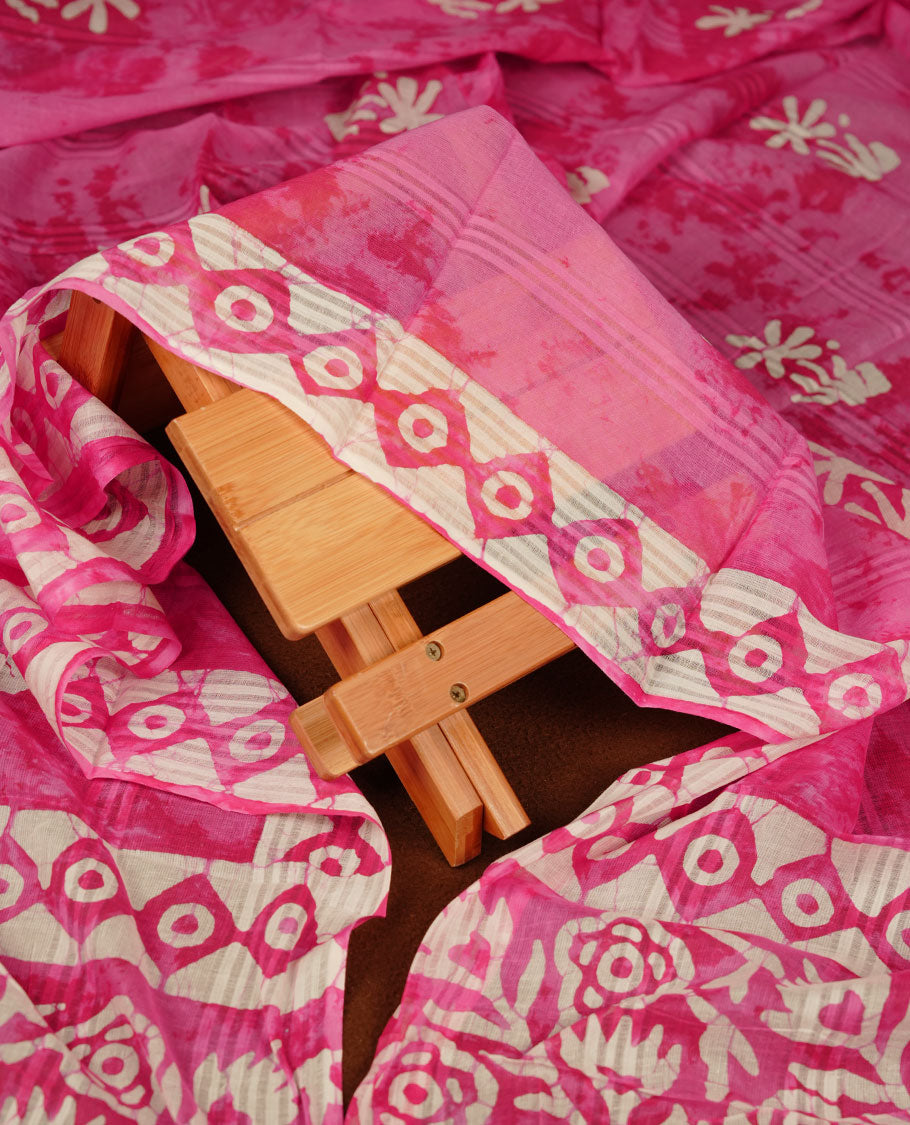 Pink colour churidar material featuring white floral printed body, paired with a matching chevron printed dupatta.
