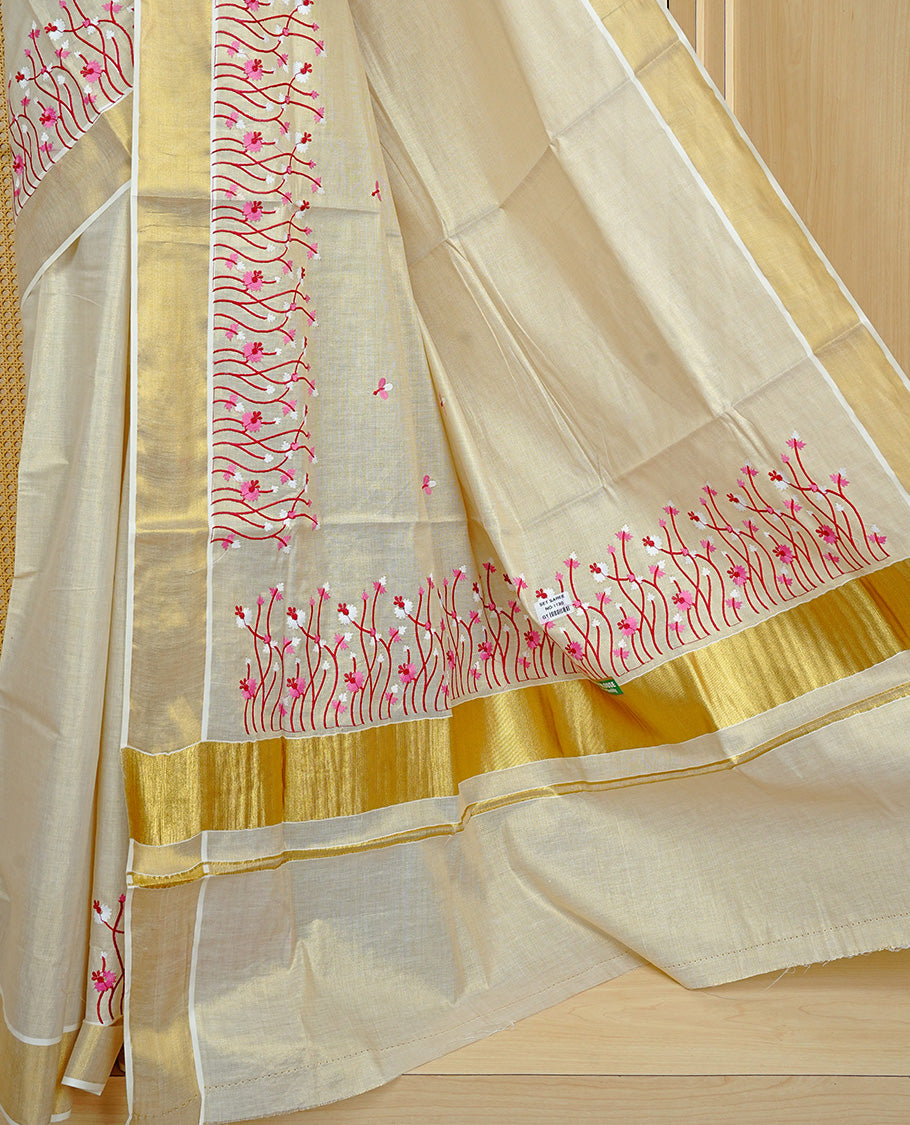 Cream colour Tissue kerala saree featuring Embroidery buttas on body, complemented by Floral thread work & kasavu kara, comes with matching blouse piece.