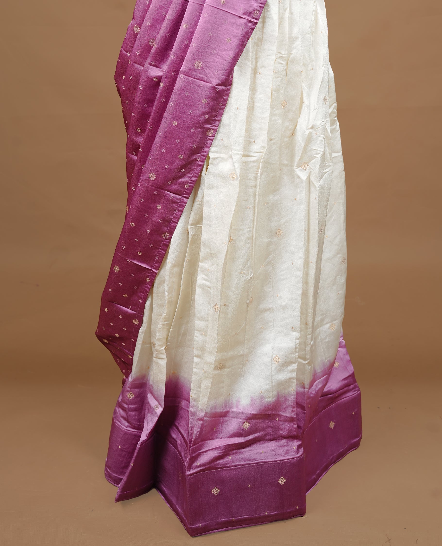 Off White colour half saree material featuring delicate zari buttas on the blouse and skirt, paired with a contrast Pink zari border and matching small zari motifs dupatta