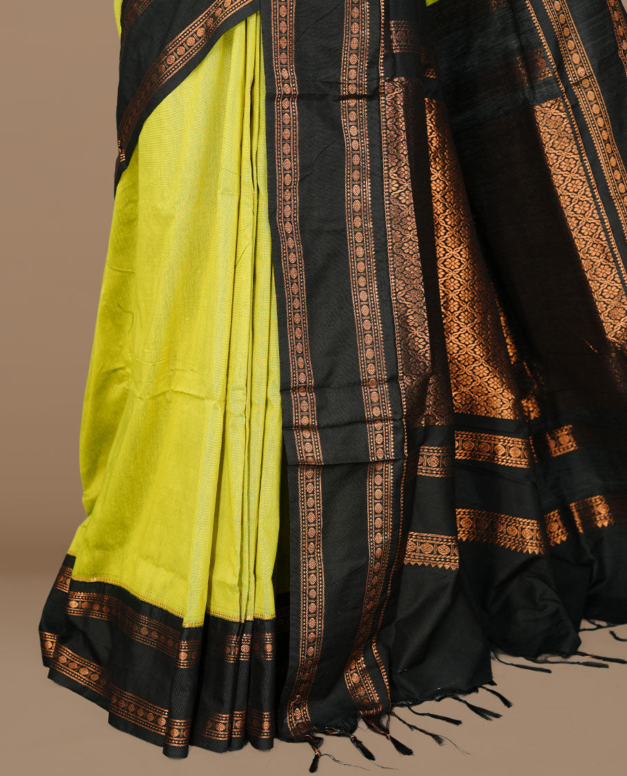 Lemon colour kalyani cotton saree featuring Elegant plain body, complemented by black colour with Antique zari border, paired with matching blouse piece.