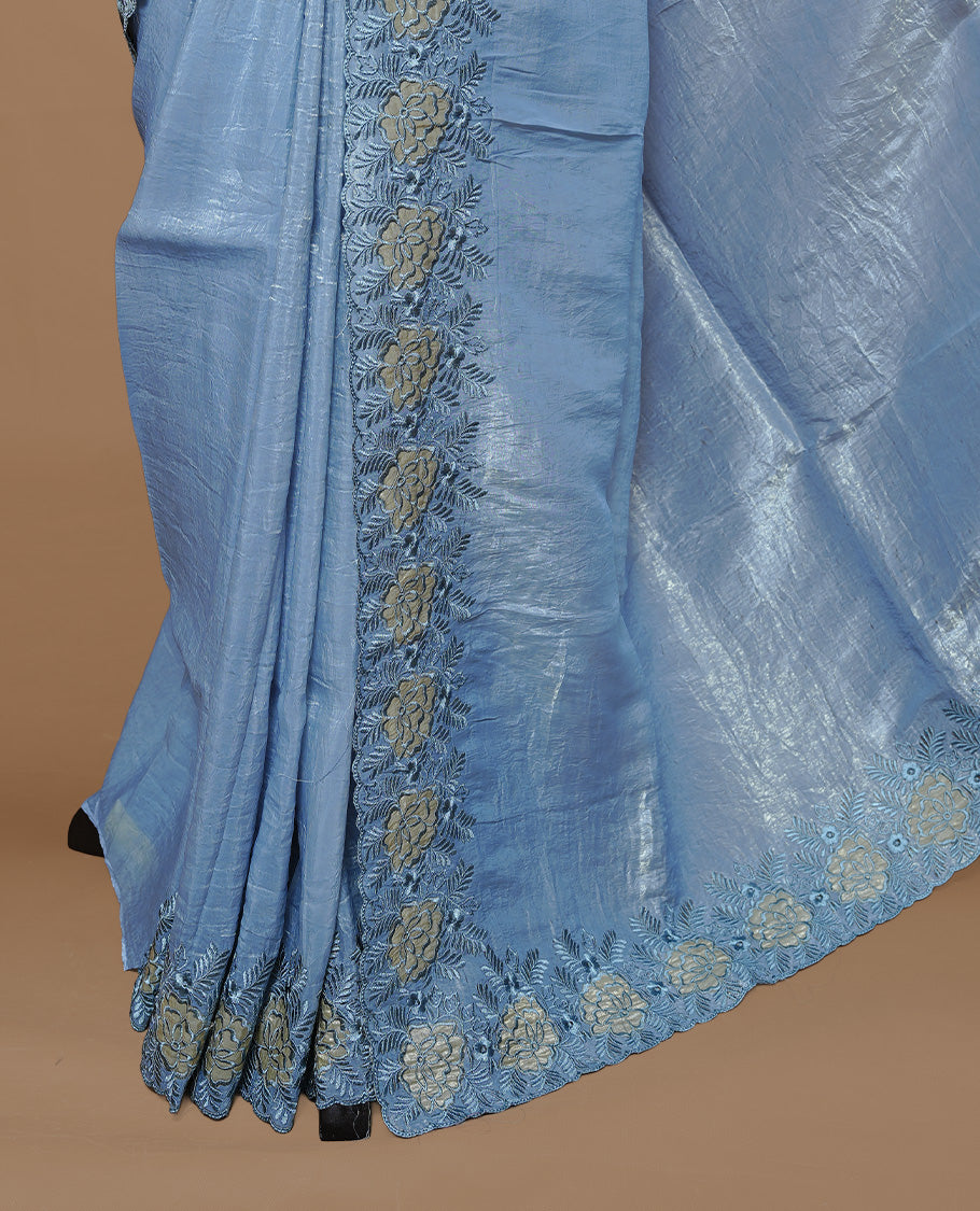 Pastel Blue colour Crush Organza Featuring Plain body, Enrich with Floral thread pattern & scalp border, paired with matching blouse piece.