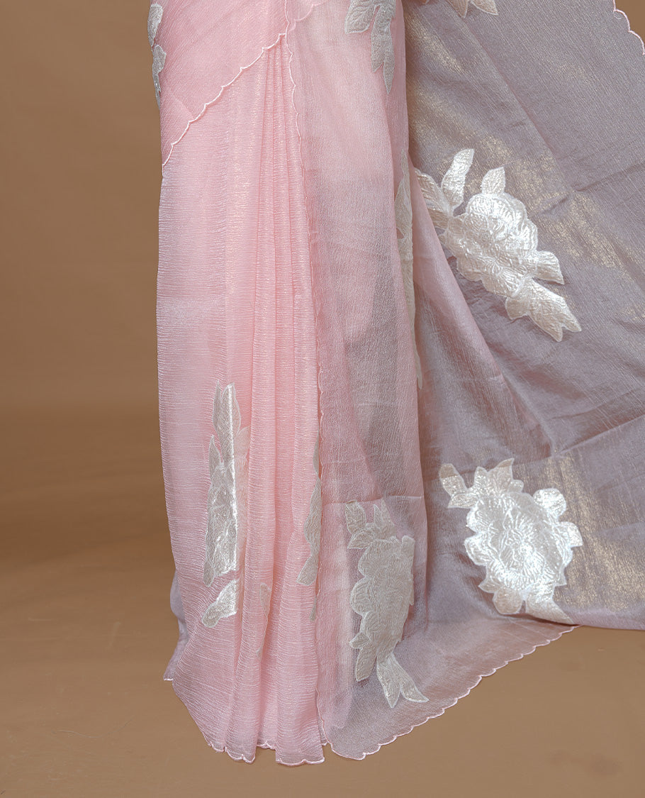 Pastel peach colour Crush Organza Saree featuring White floral Pattern on body, complemented by classy Thread border, paired with matching blouse piece.