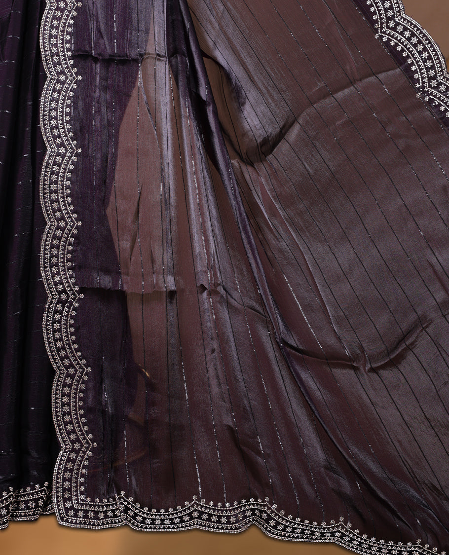 Dark Grape colour chiffon designer saree, featuring self colour beats stripes on body, heavy gold stone patttern on border and  pallu, Paired with matching blouse.