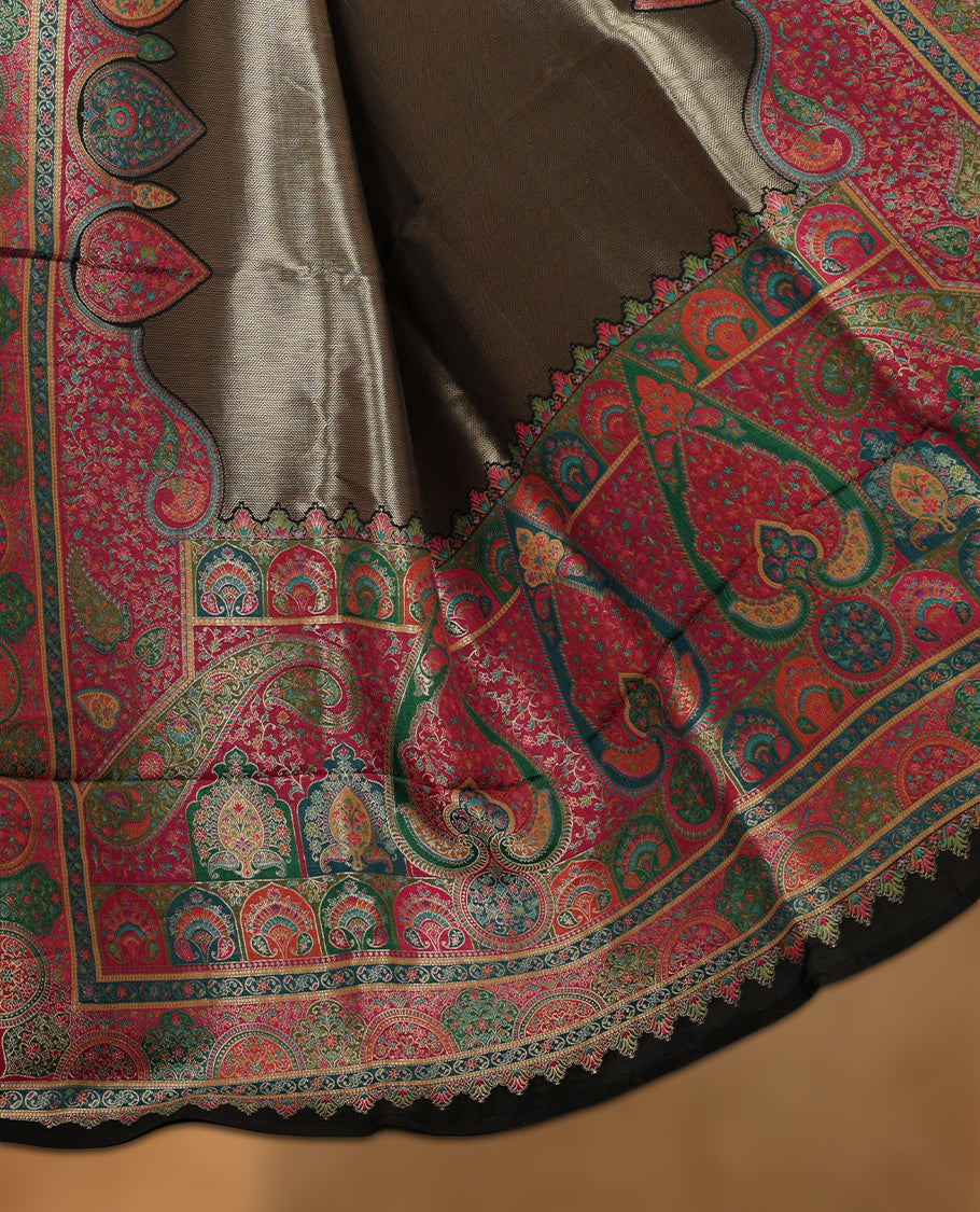 Antique bronze colour Pashmina silk saree featuring a sleek plain body, highlighted with an opulent multicolour paisley and floral panelled border and grand pallu, paired with a contrasting black woven jaal blouse piece.