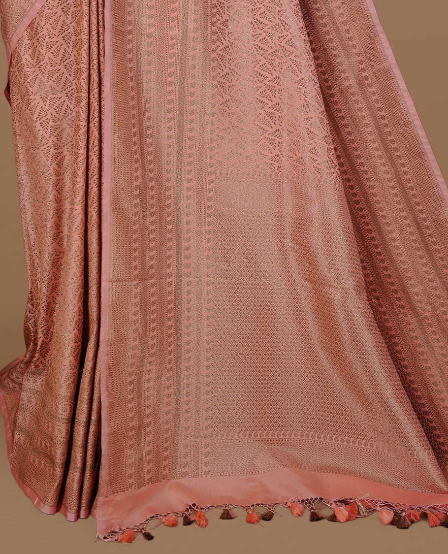 Peach colour Semi Banaras Katan saree featuring Antique zari Floral pattern on body, complemented by self colour zari border, paired with matching blouse piece.