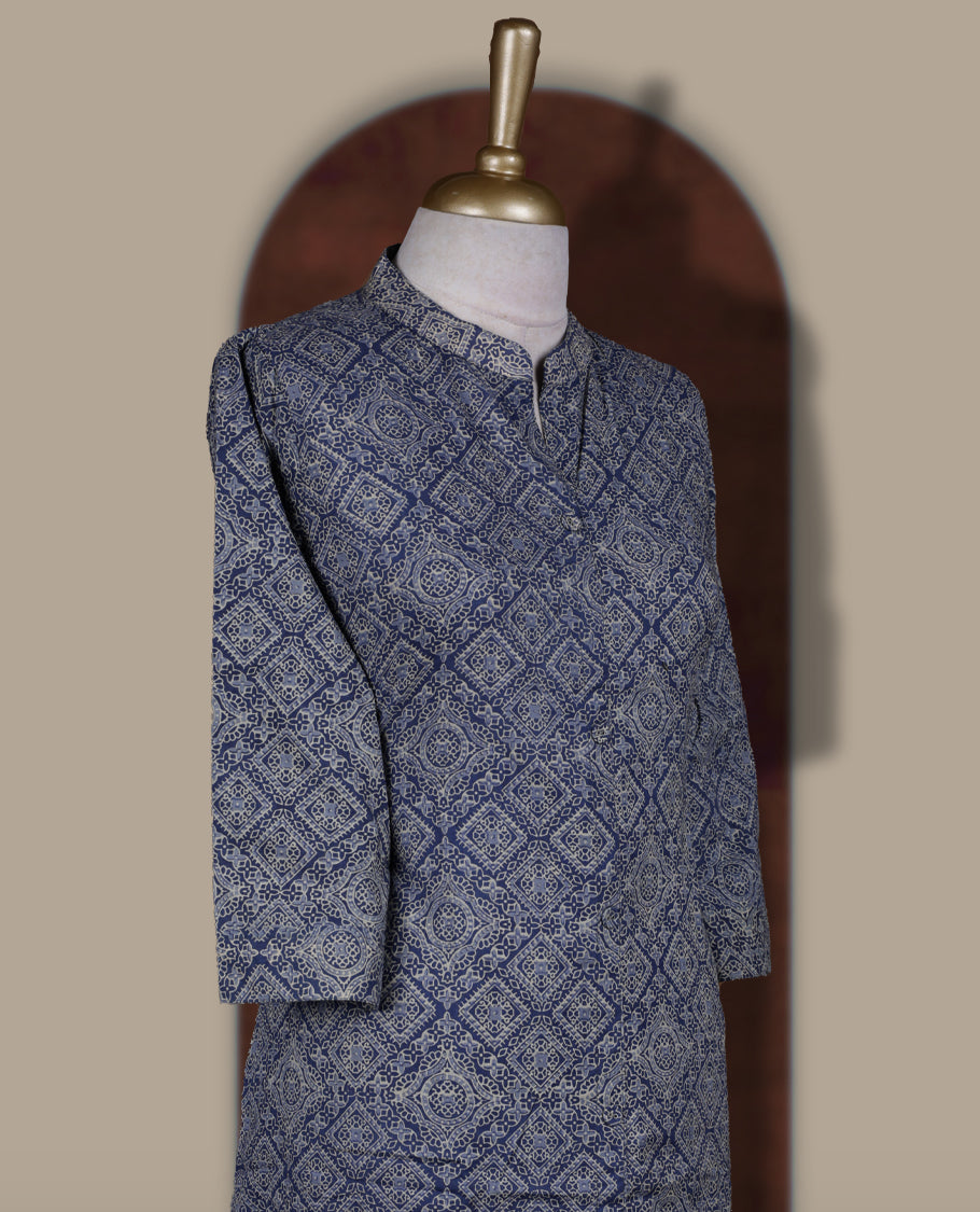 Dusky blue colour cord set with geometric white prints, Features a straight fit kurta with a mandarin collar, button down front, and 3/4 sleeves, paired with matching straight pants for a stylish ethnic look.