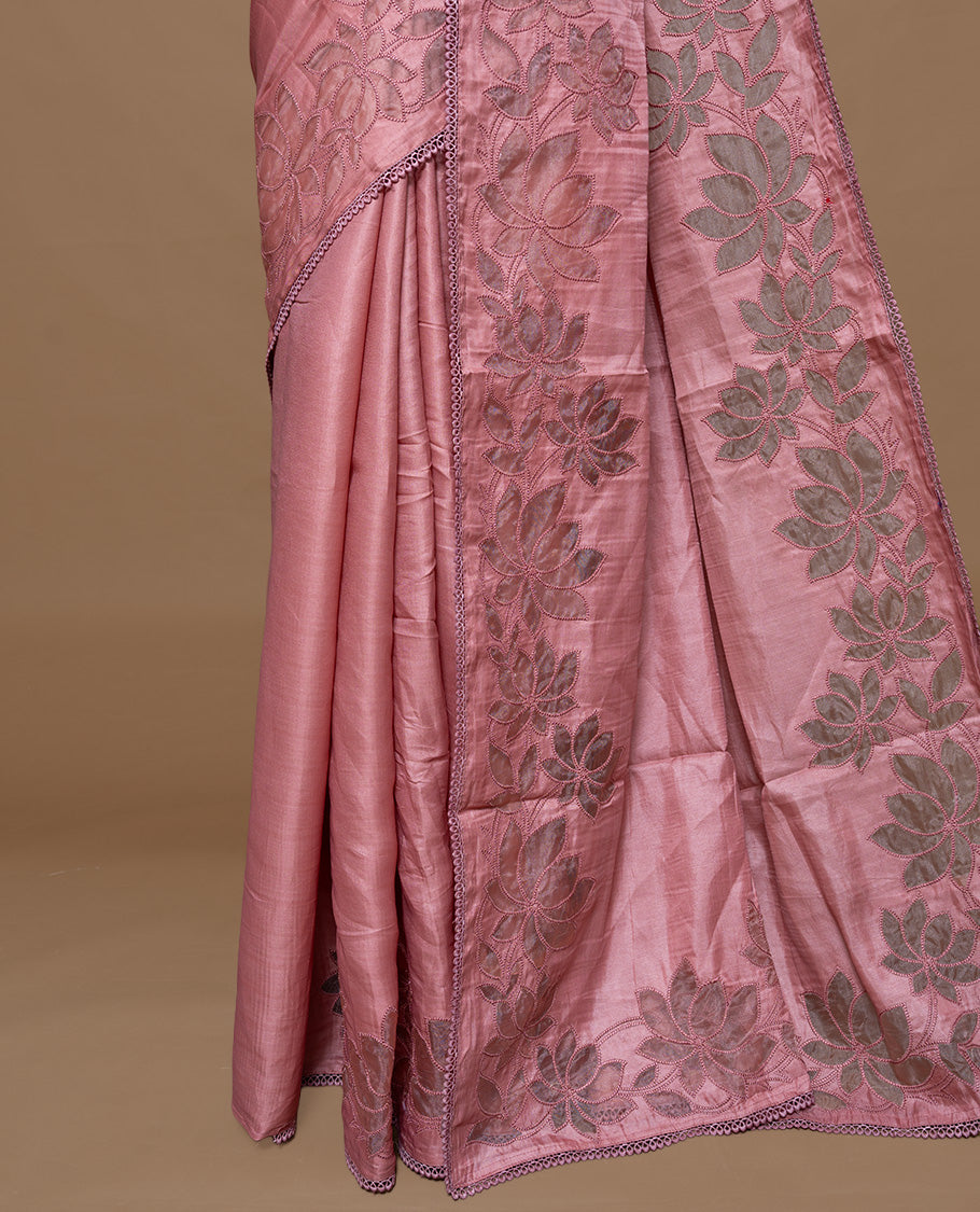 Pastel Peach colour Designer saree Featuring Elegant plain body, enhance with thread Lotus Pattern with lace border, paired with matching blouse piece.