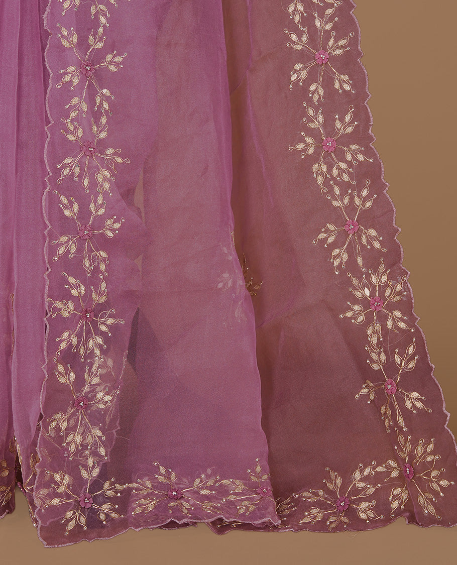 Dusty Pink colour crush organza saree featuring gold thread floral and stone worked body, highlighting scalp designed border, paired with matching blouse piece.
