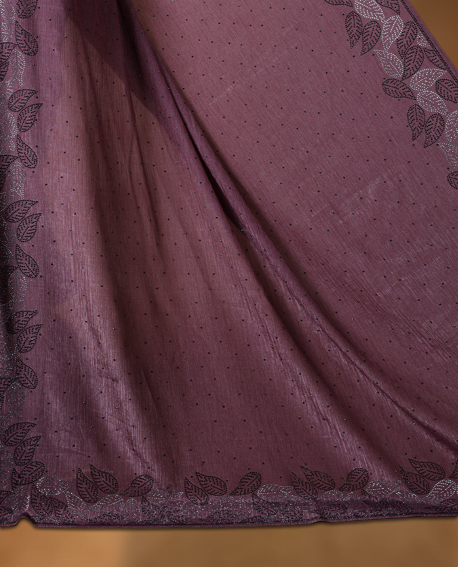 Grape colour chiffon designer saree, featuring black and white scattered stone on body, stone work and heavy stone leaf pattern on border and  pallu, Paired with matching blouse.