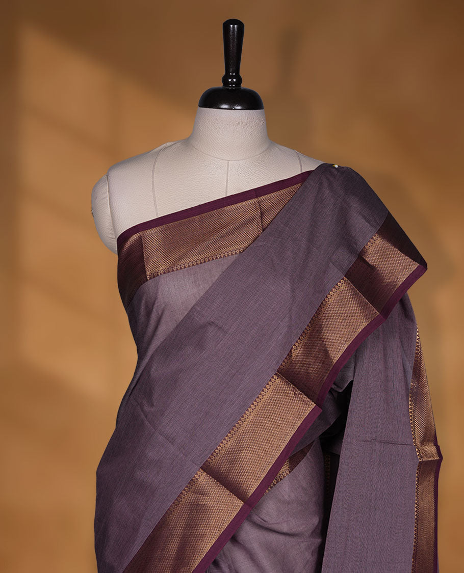 Lilac colour chettinad cotton saree featuring Elegant plain body highlighting contrast Maroon colour with gold zari traditional border, pallu and paired with matching blouse piece.