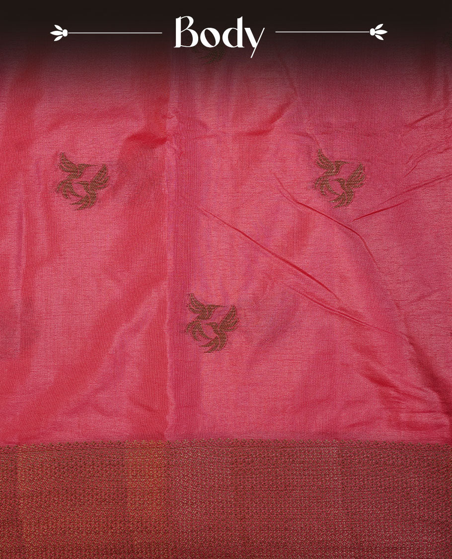 Pinkish red colour semi banaras tussar silk saree highlighting gold zari bird motifs on body, complemented by self colour with antique zari border, paired with matching blouse piece.