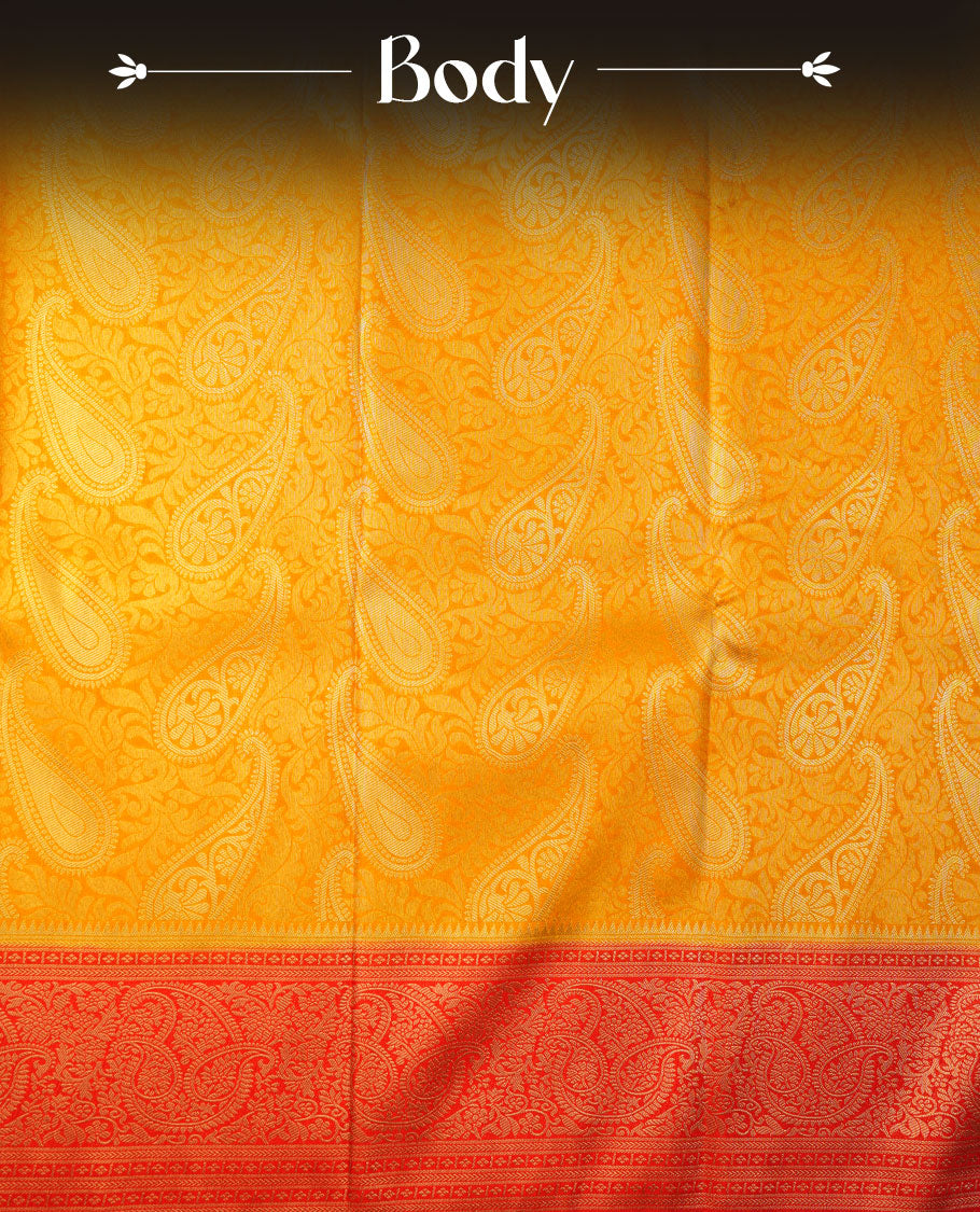 Mustard yellow colour semi soft silk brocade saree featuring elegant gold woven motifs across the body, highlighted with a contrasting red richly detailed border and pallu, paired with a matching blouse piece.