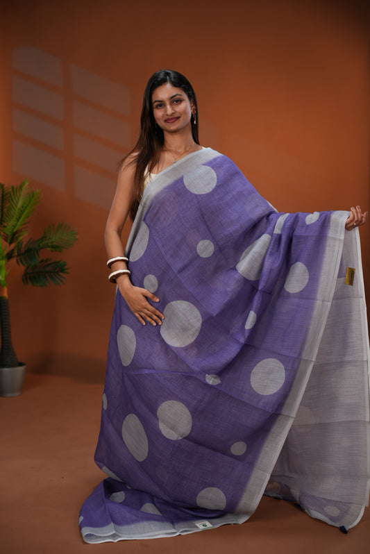 Purple colour Linen saree featuring Grey Polka dot on body, Contrast Border and Blouse.