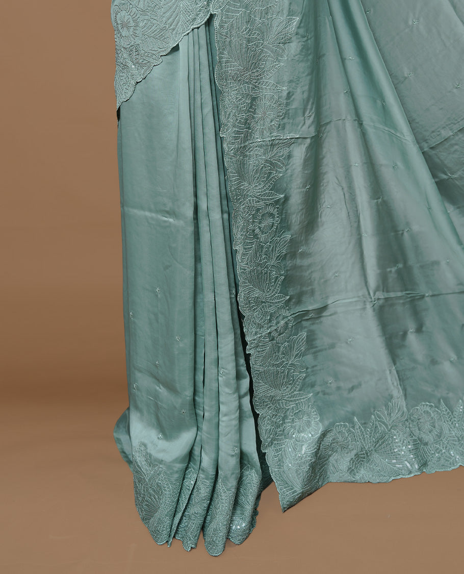 Pastel Green colour Designer saree featuring Elegant Thread & sequins  body, complemented self colour thread & Sequins scalp border, paired with matching blouse piece.