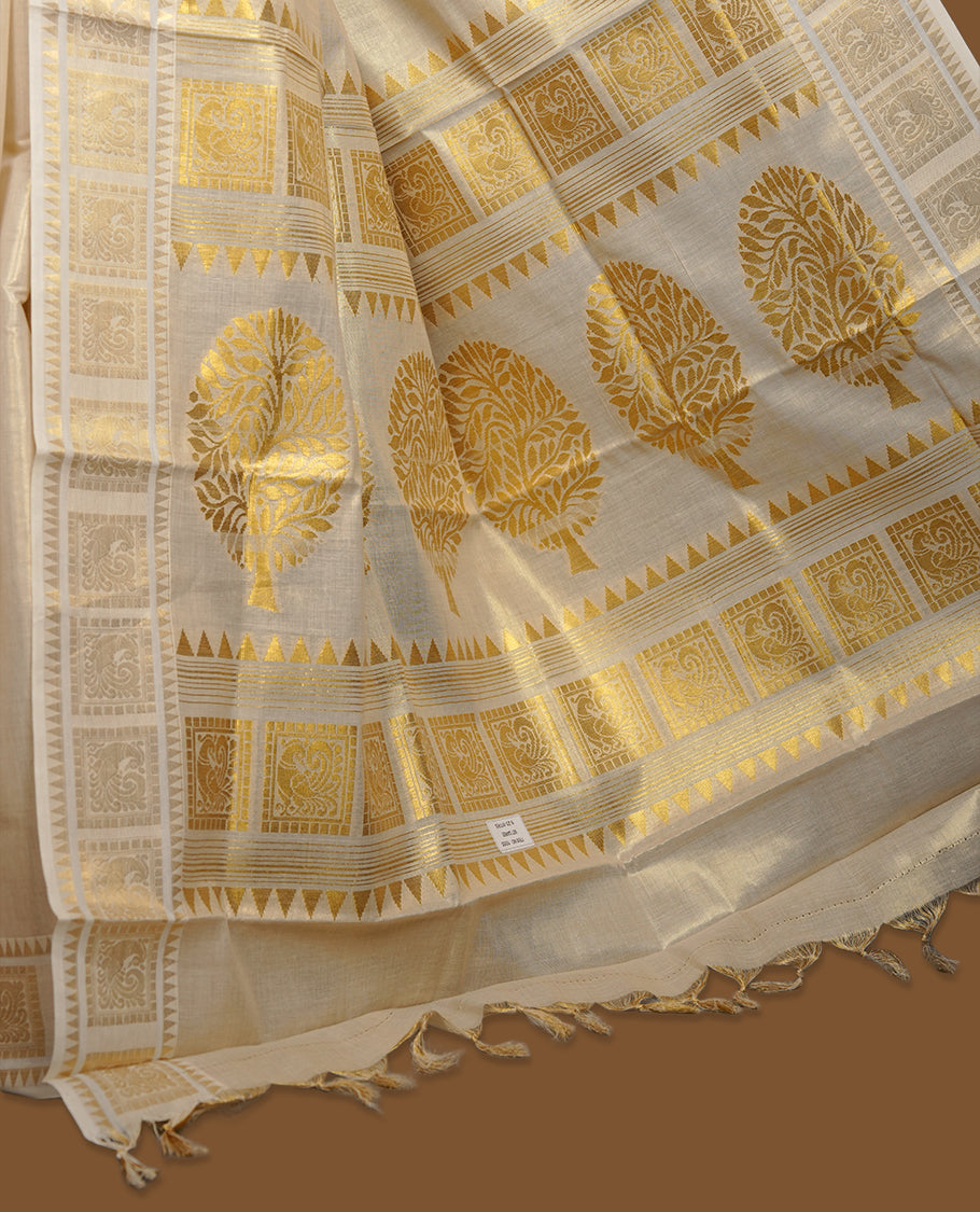 Elegant Light gold colour tissue Kerala saree with tree design gold zari buttas, broad kasavu border, and richly woven traditional pallu, paired with a matching blouse