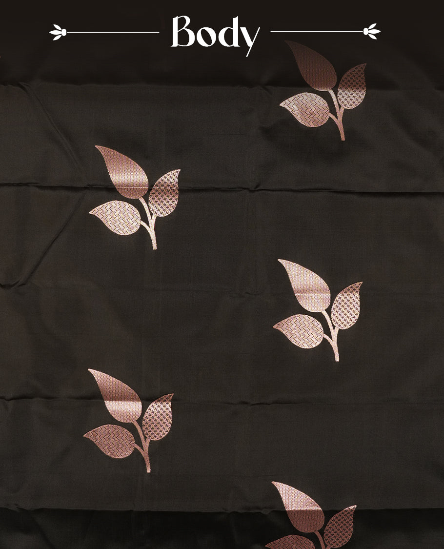 Black Semi Silk Saree with Rose Gold Satin-Finish Pallu Featuring Bold Leaf Motifs, Geometric Zari Edging and Tassels, Paired with Coordinated Blouse Piece