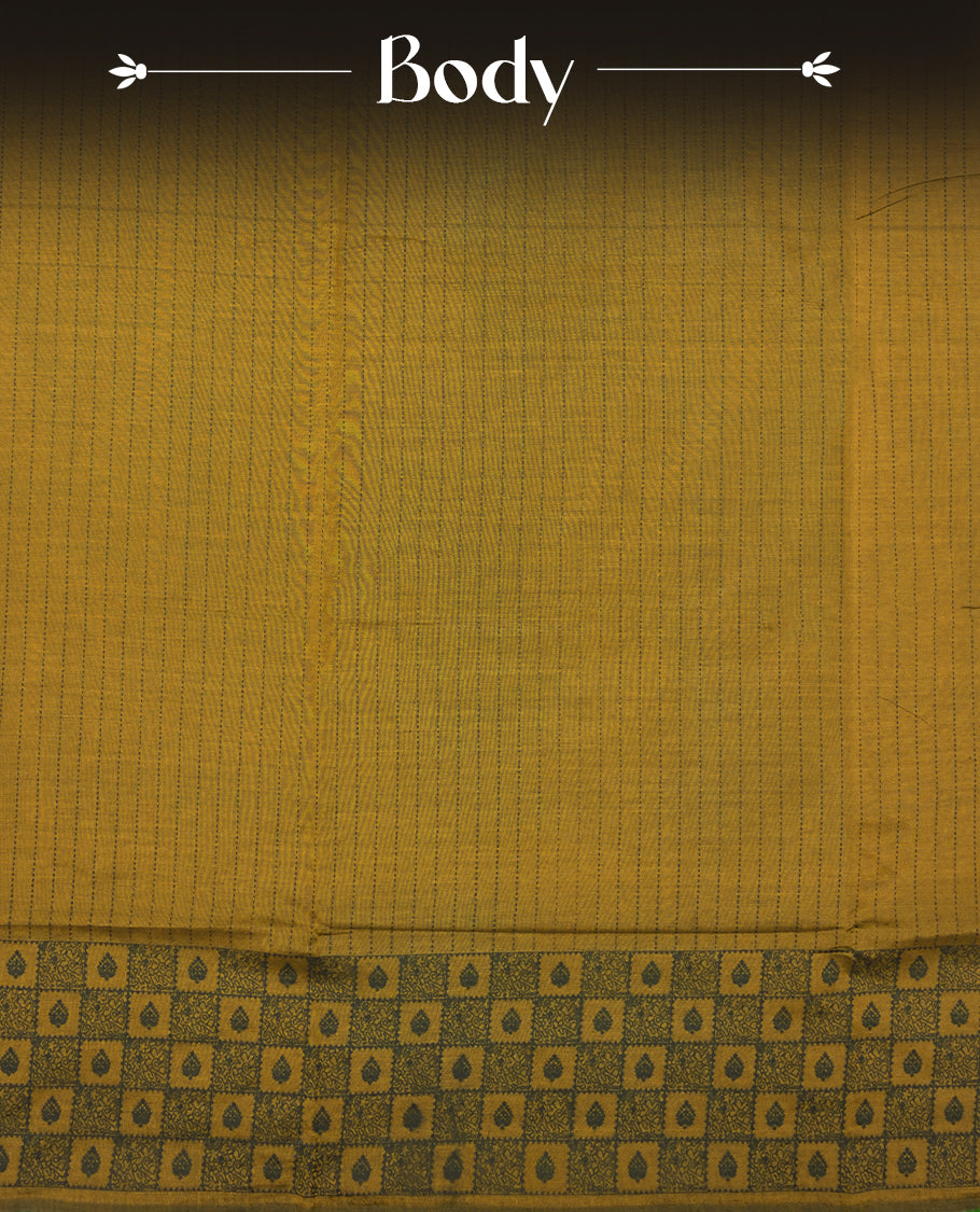 Dark Mustard colour poly cotton saree with black vertical dotted line pattern on the body, paired with a matching pallu featuring zigzag geometric border, and a coordinated all‑over black stylised fleur‑de‑lis printed blouse piece.