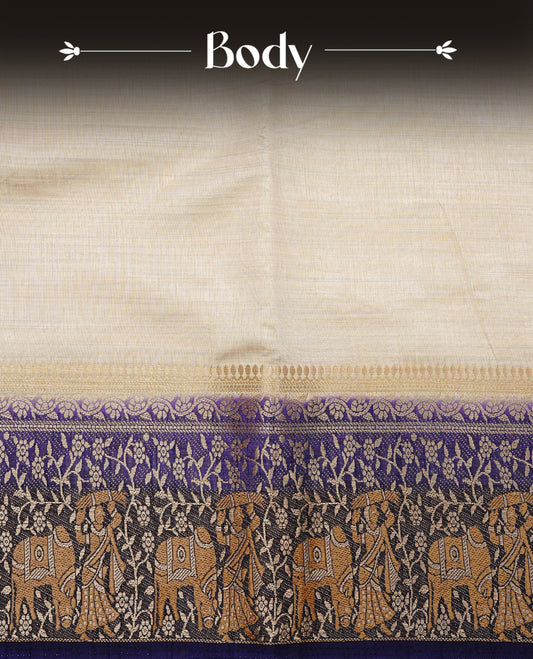 Light gold tussar saree featuring Elegant plain body, complemented by contrast Navy Blue colour with Gold zari Floral kodi with Women & Cow Pattern border, comes with matching blouse piece.