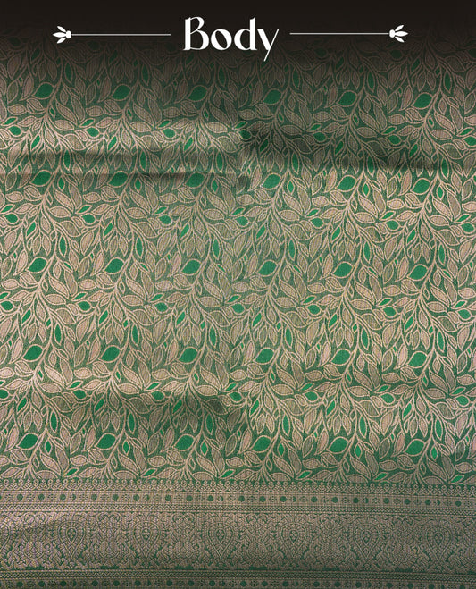 Bottle Green  Colour Softie Silk Saree Featuring An All Over Gold Woven Leaf Pattern, Finished With A Matching Border Adorned With Intricate Paisley And Floral Motifs, Paired With A Matching Blouse Piece.