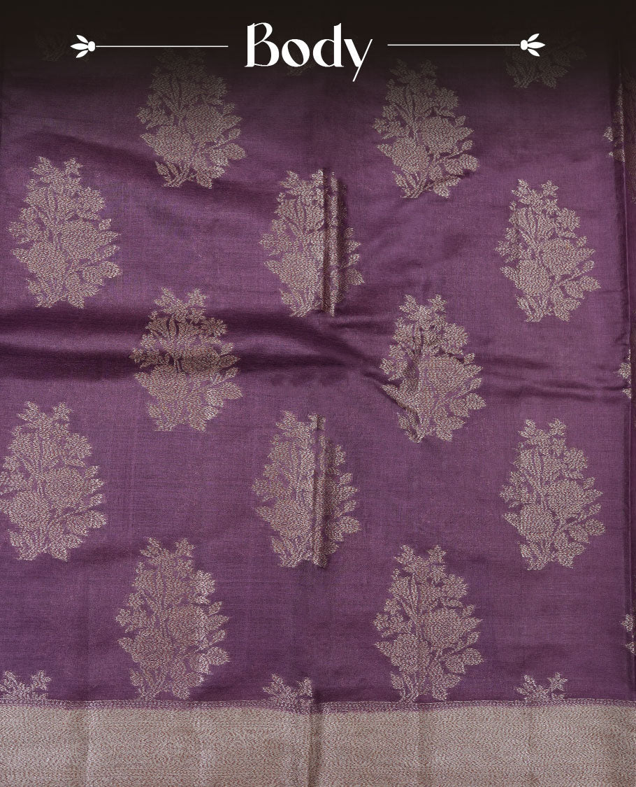 Purple colour pure banaras tusser silk saree highlighting antique zari pattern across body, with contrast cream colour with zari border and paired with matching blouse