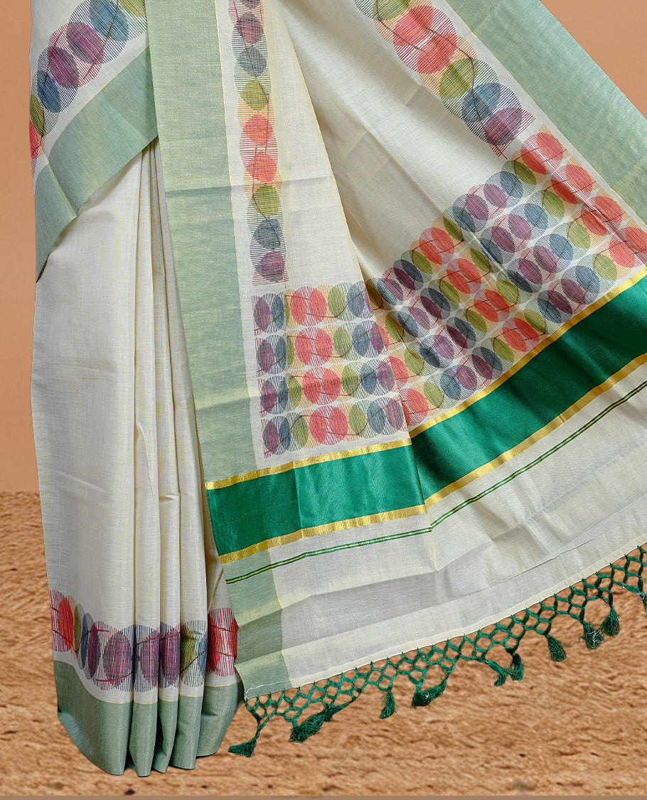 Cream Colour Tissue Kerala Saree Featuring Multicolour Circular Prints Along The Border And Pallu, Complemented By A Light Green Border With Traditional Gold Zari Accents, Paired With A Matching Blouse Piece.