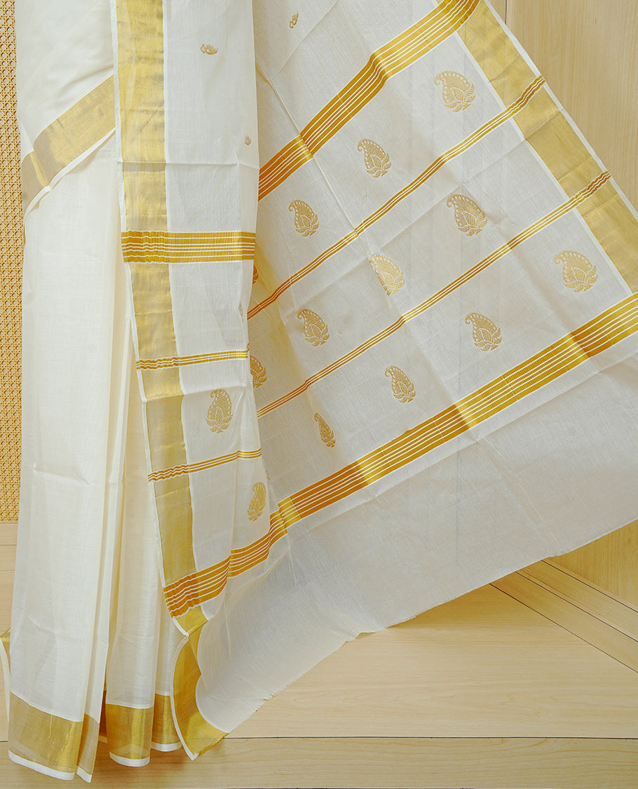 Cream Colour Cotton Kerala Saree Featuring Delicate Gold Mango Motifs Across The Body, Enhanced With A Traditional Gold Zari Border, A Gold  Mango & Striped Gold Zari Pallu, Finished With A Matching Blouse Piece