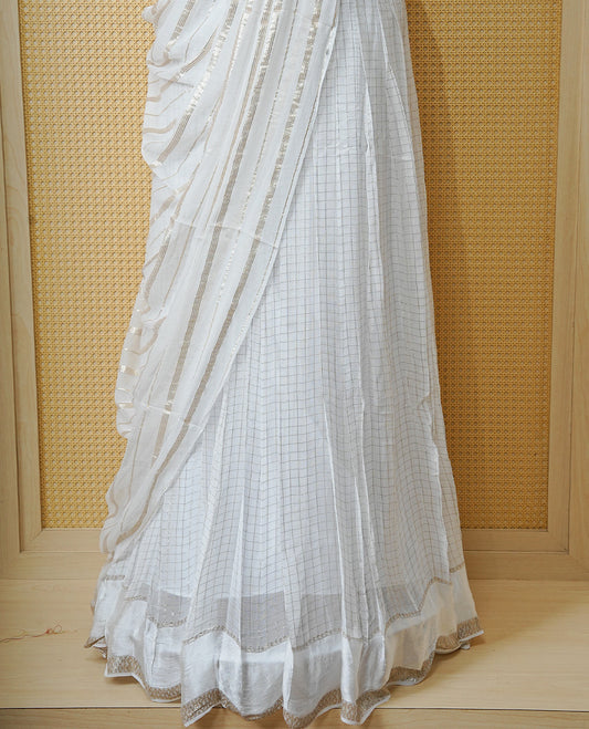 Off white colour Semi stitched dhavani set featuring Gold zari check pattern with Self colour border skirt, paired with matching blouse & dupatta.