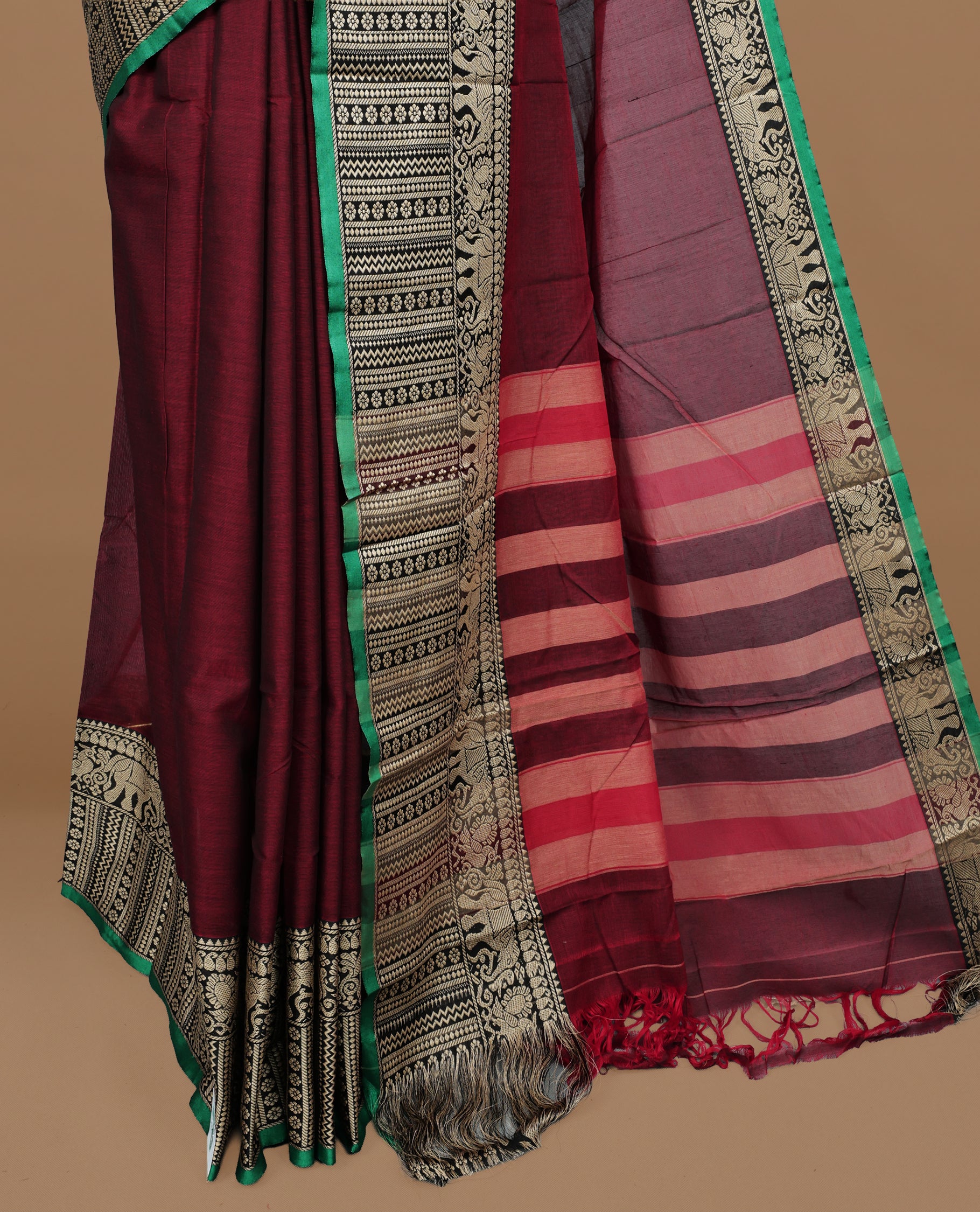 Maroon colour Narayanapett cotton saree Featuring Elegant plain Body, complemented by Contrast Black colour with cream zari border, paired with matching blouse piece.