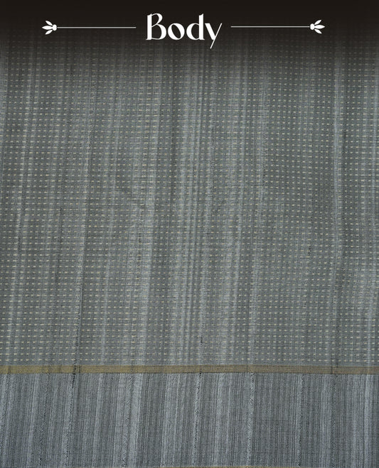 Grey colour semi tussar silk saree featuring elegant gold zari dotted stripes across the body, enhanced with a rich zari woven border. Comes with a matching blouse piece.