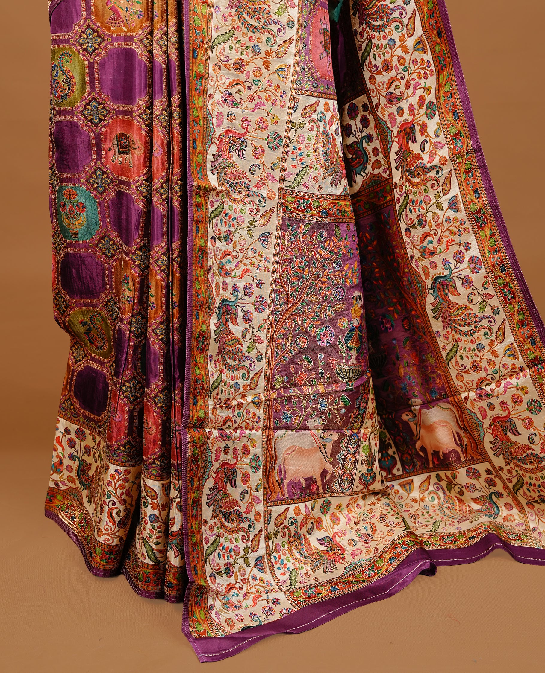 Purple colour Pashmina Saree featuring multicolour geometric and paisley woven body, a contrast multicolour floral & bird border with Purple edging, an ornate paisley woven pallu, paired with a matching blouse.