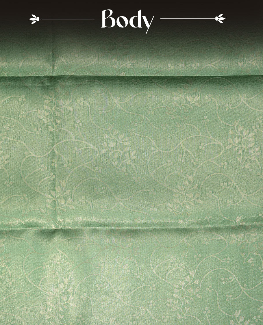 Green colour semi tussar silk saree, featuring an intricate gold zari floral kodi pattern on the body and pallu, comes with matching blouse.