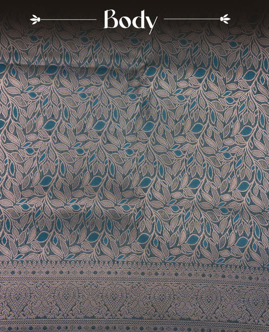 Teal Blue  Colour Softie Silk Saree Featuring An All Over Gold Woven Leaf Pattern, Finished With A Matching Border Adorned With Intricate Paisley And Floral Motifs, Paired With A Matching Blouse Piece.