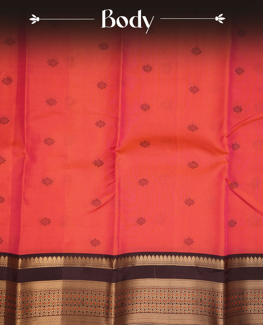 Burnt orange colour vasundhara silk sareee featuring zari buttas on body, complemented by contrast deep maroon colour with zari border, paired with matching blouse piece.