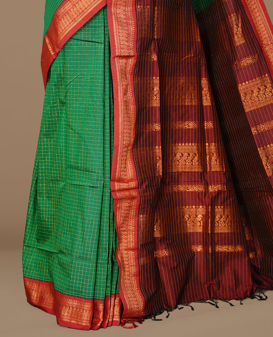Green colour kalyani cotton saree featuring gold zari check pattern on body, complemented by Maroon colour with Antique zari border, paired with matching blouse piece.