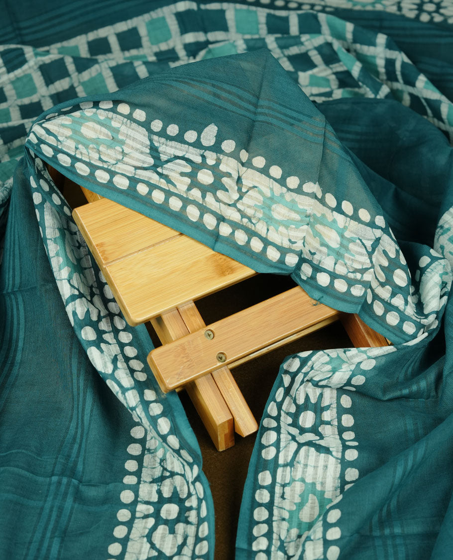 Dark Blue colour churidar material featuring a checked printed body with subtle motifs, paired with a matching bottom and coordinated printed dupatta.