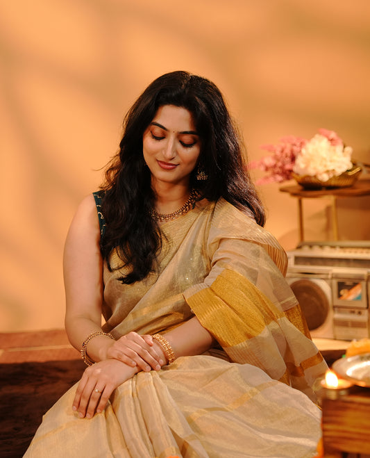 Golden Khadi Tissue Saree Featuring Bold gold stripes on body, Complemented by Kasav border for Onam special