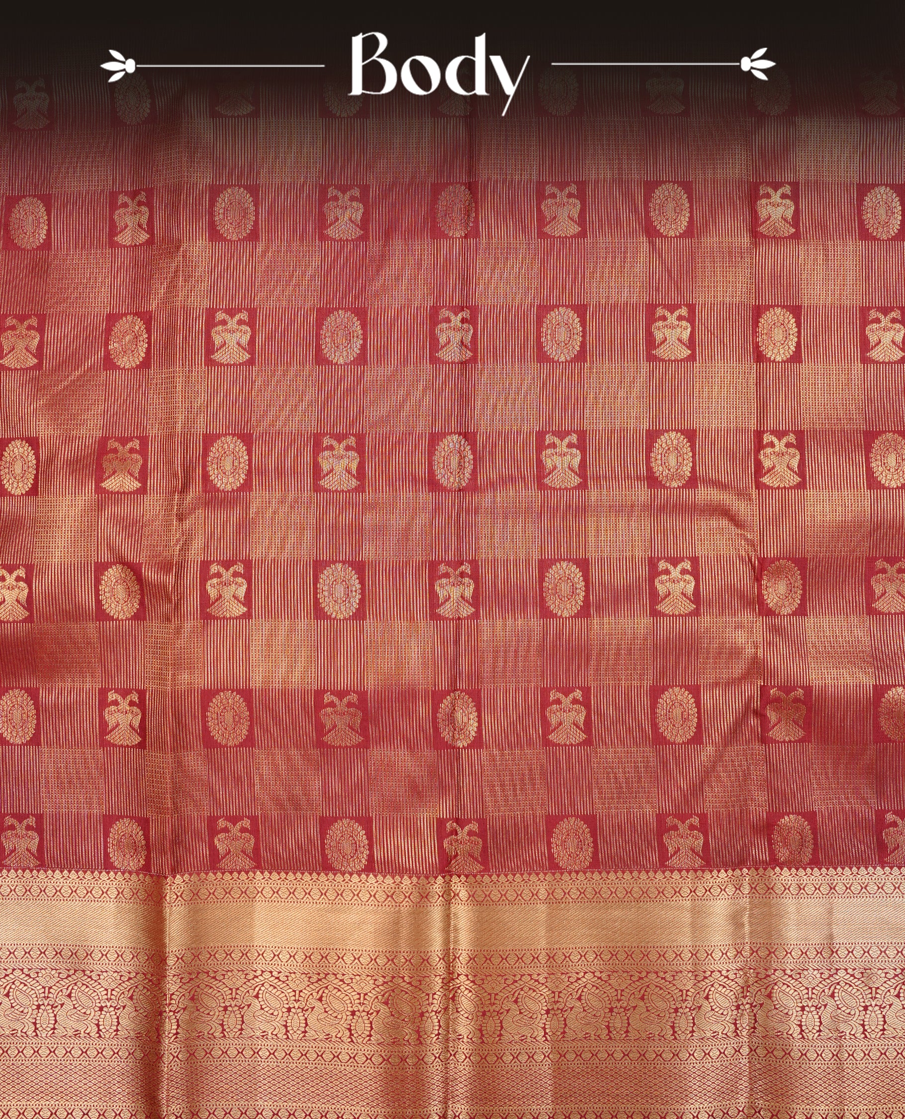 Maroon Colour Semi Wedding Silk Saree Featuring Gold Zari stripes With Chakkara & Peacock Buttas, Showcased with Green colour pipping With Traditional Border,  Paired With Matching Blouse Piece.