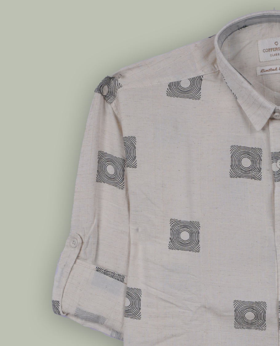 Off white colour shirt adorned with minimal black geometric square prints, Features a classic collar, full sleeves, and a front pocket & perfect for a relaxed yet refined casual look.