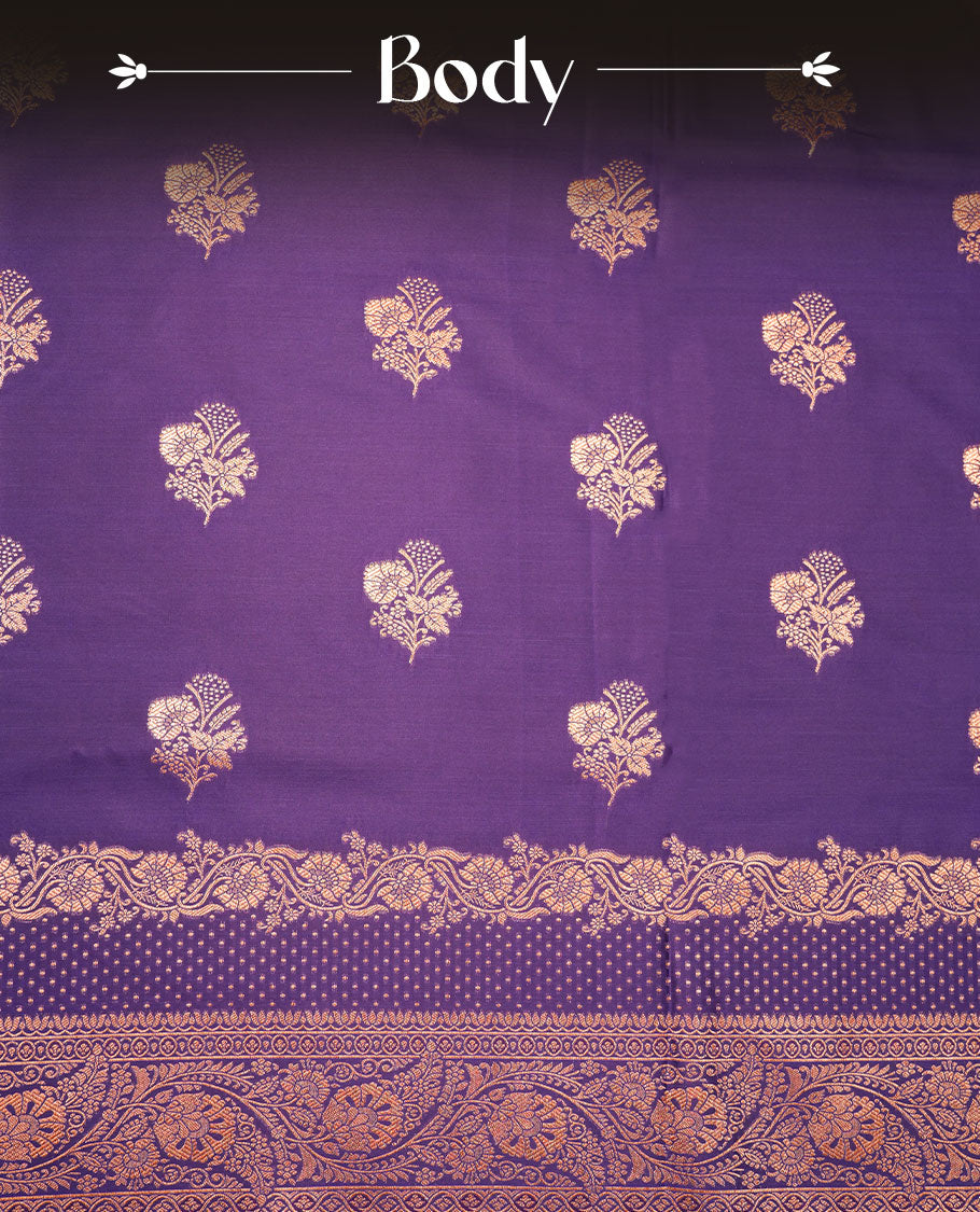 Indigo colour Banaras Satin Crepe saree featuring gold zari floral motifs on the body, a richly woven traditional border with intricate gold zari detailing, and paired with a matching blouse.
