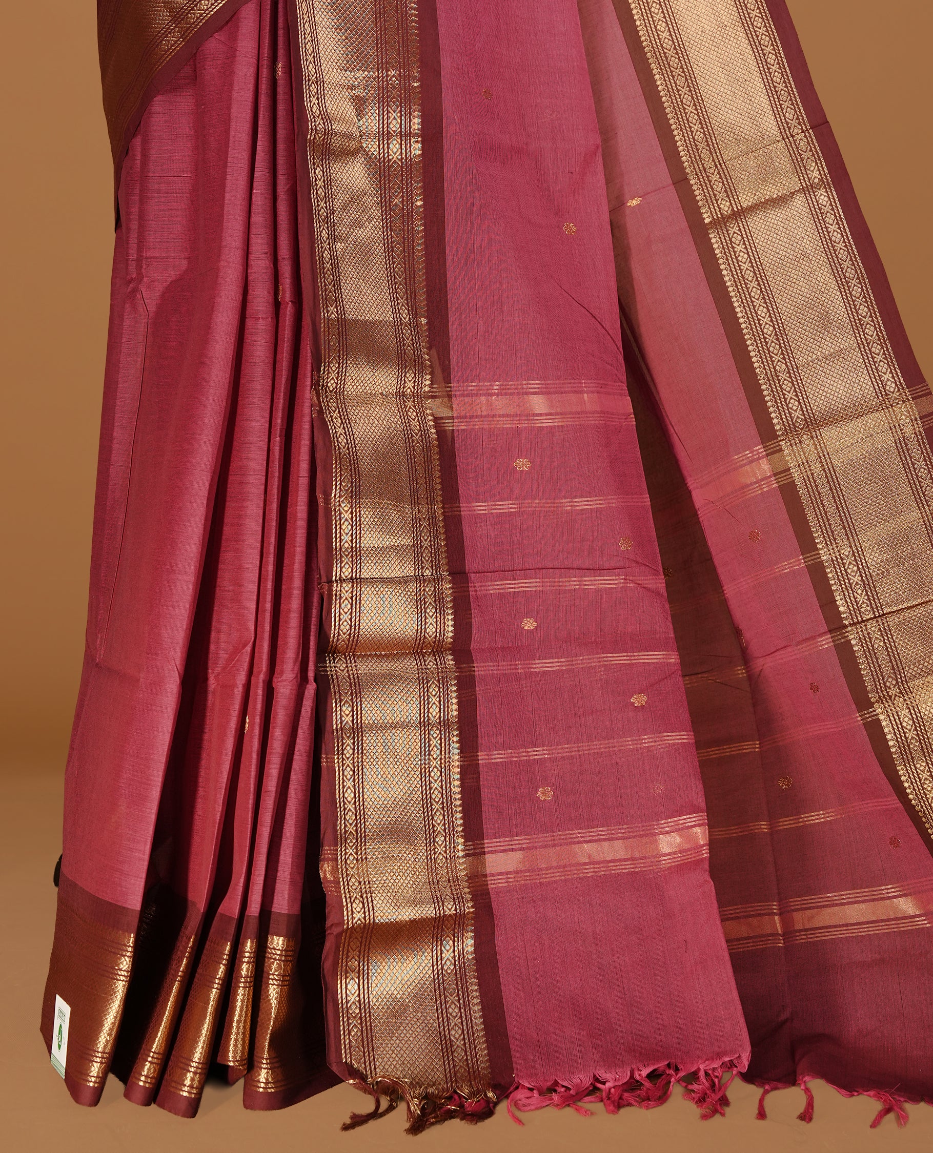 Mauve colour Chettinad cotton saree featuring Gold zari motifs body, complemented by contrast Chocolate Brown colour with gold zari border, paired with matching blouse piece.
