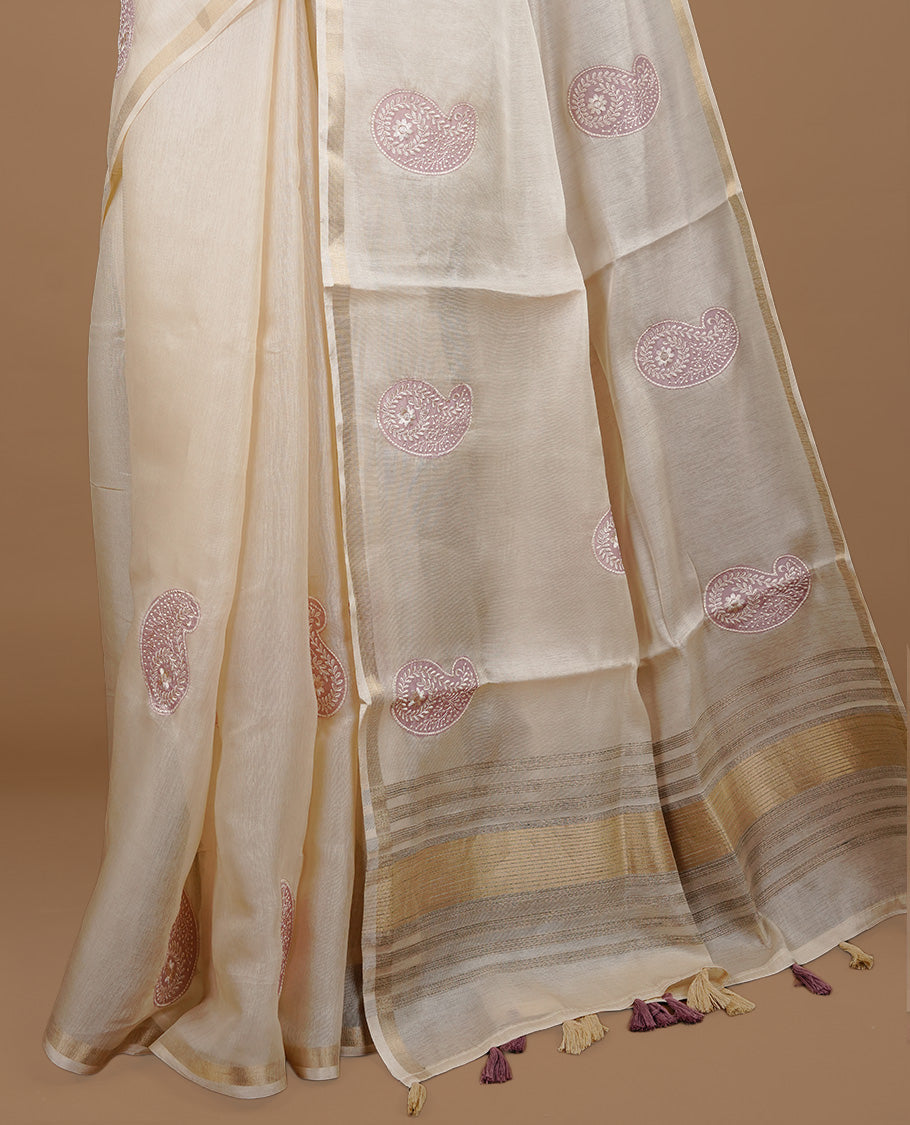 Cream colour Tussar saree featuring Mauve colour Mango pattern with chikankari embroidery work, highlighting gold zari simple border, paired with matching unstitched blouse.